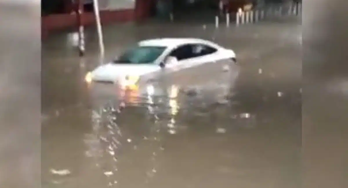 car submerged on the road due to heavy rain in hyderabad