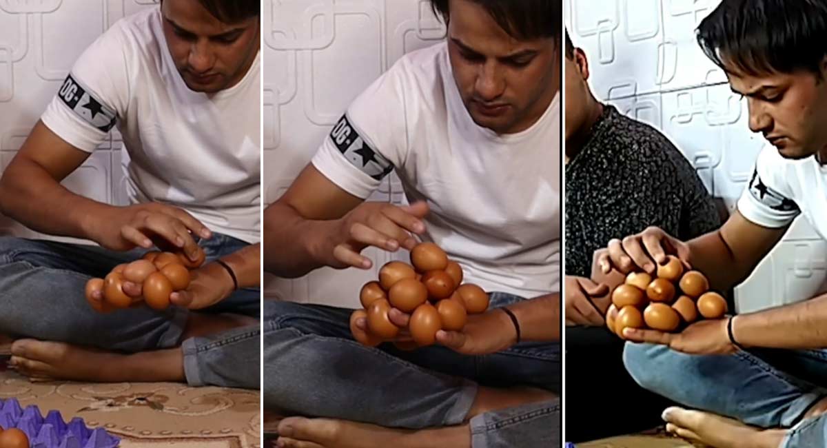 a man balancing 18 eggs on his fingers