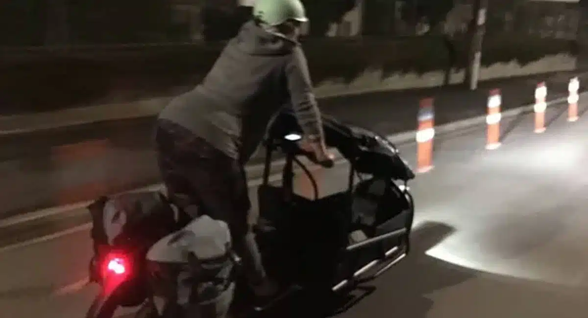 a woman riding a bicycle and giving birth to a-baby