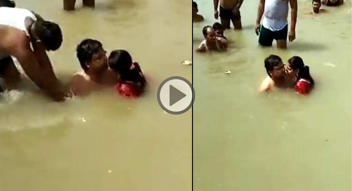 husband and wife enjoying in sarayu river in ayodhya city in uttar pradesh