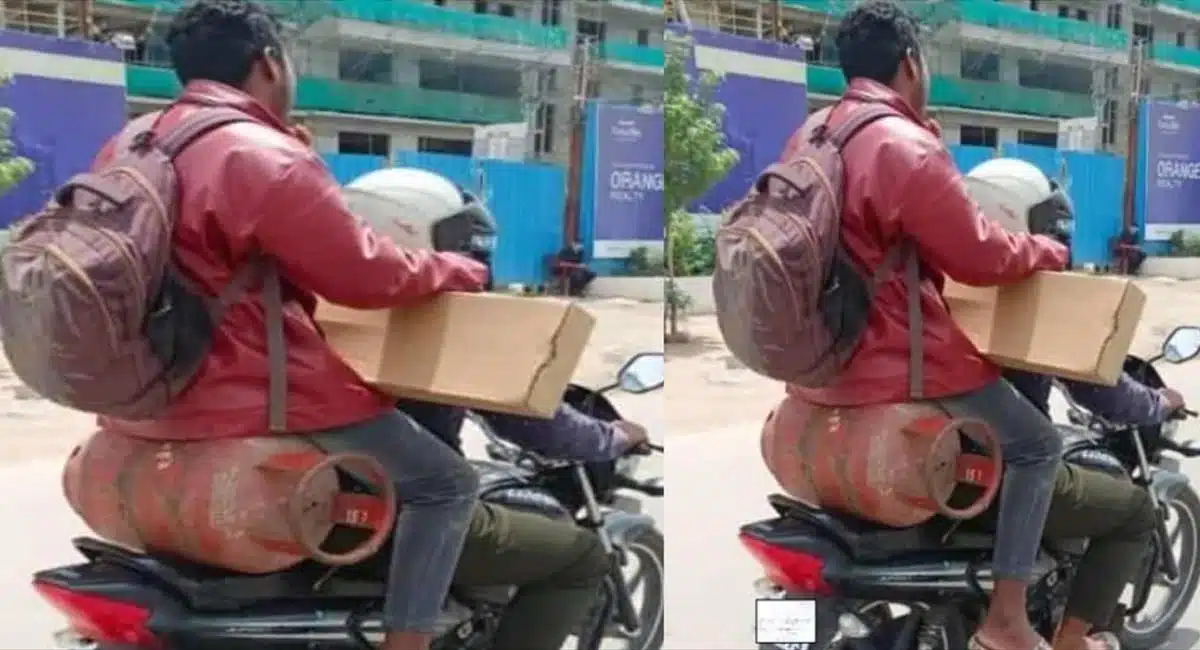 man daring stunts with cylinder on bike goes viral in social media
