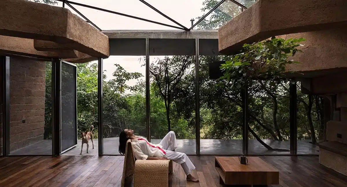 Built Amid a Canopy of Trees, This Sustainable Mud Home Is Made with 4000 Plastic Bottles