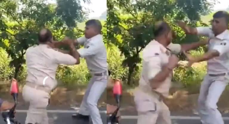 Viral Video : పట్టపగలు నడిరోడ్డుపై కొట్టుకున్న పోలీసులు .. డబ్బులు పంచుకునే విషయంలో గొడవ.. వీడియో!!
