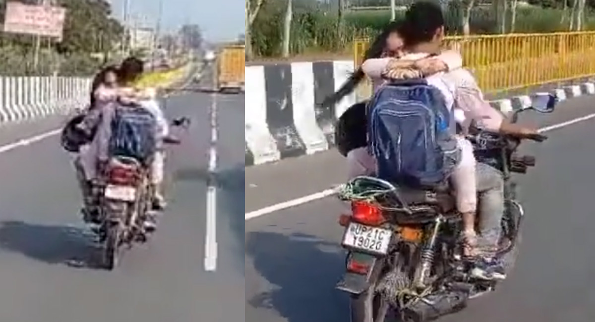 couple riding a bike on the sidewalk video