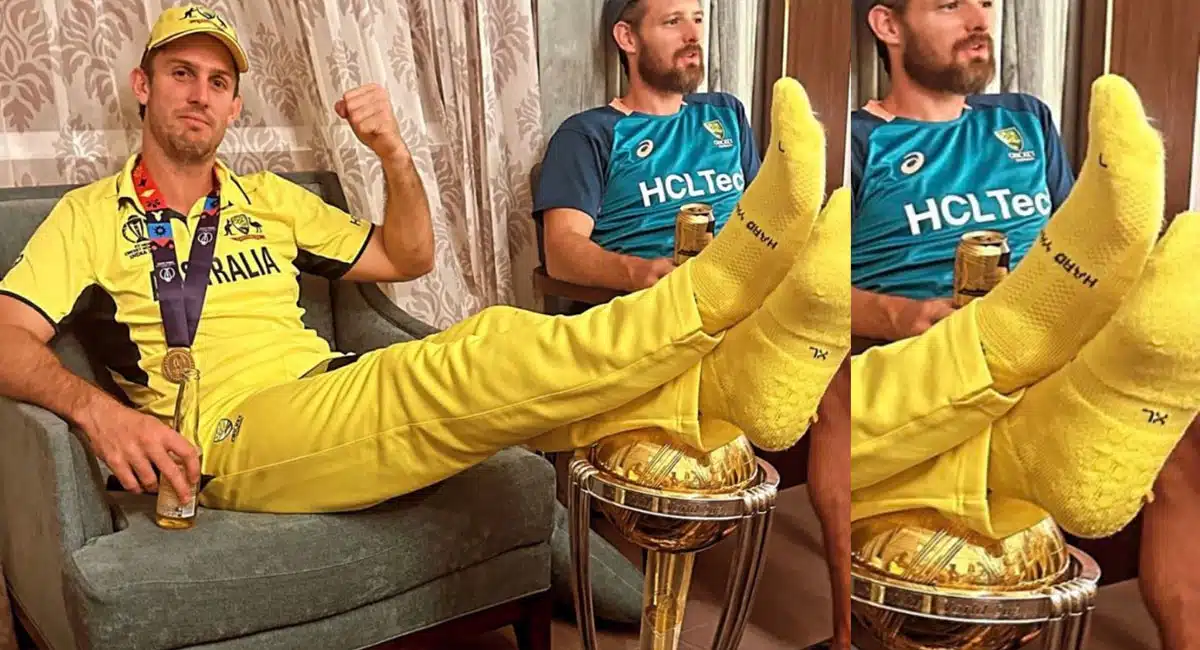 australia cricketer mitchell marsh rests his feet on world cup trophy
