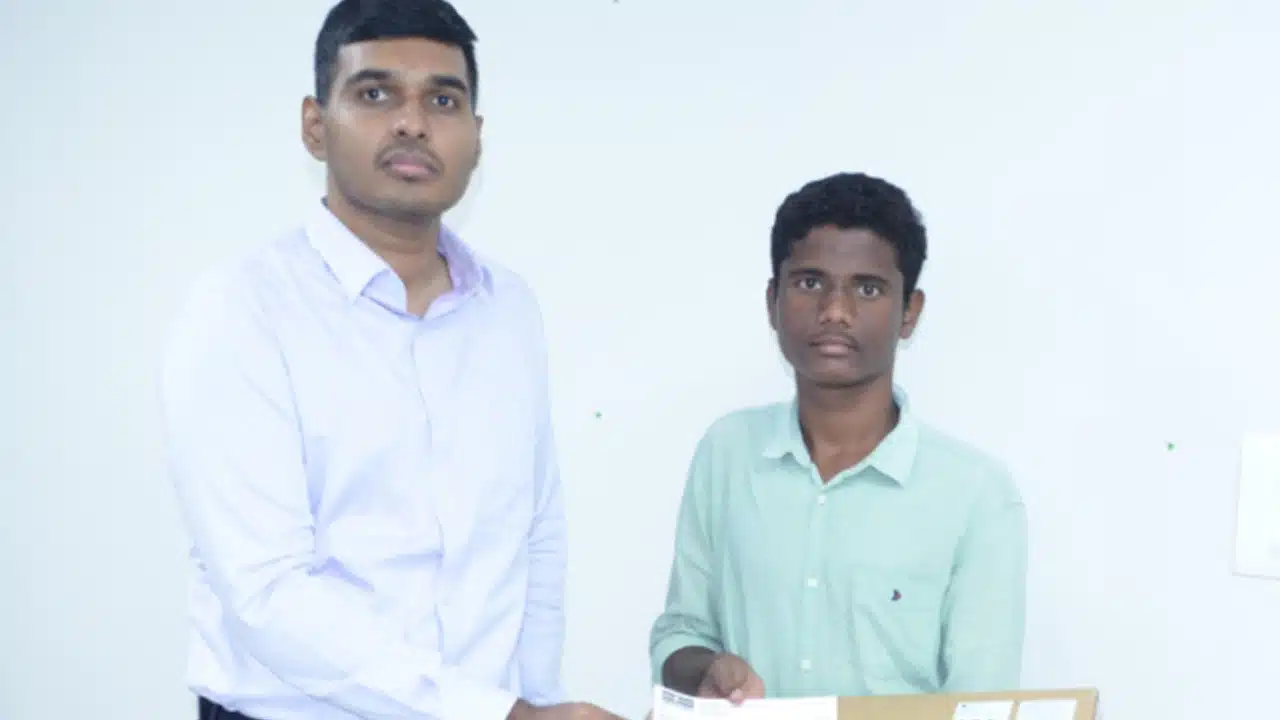 siddipet collector given laptop to Telangana Top student