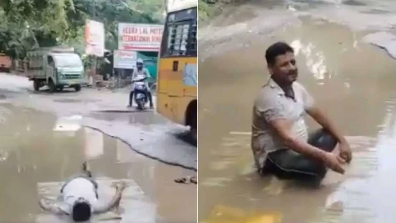 Father : గుంతలపై వినూత్న నిరసన.. నీటితో నిండిన గుంతలో పడుకుని ఆందోళన చేసిన తండ్రి